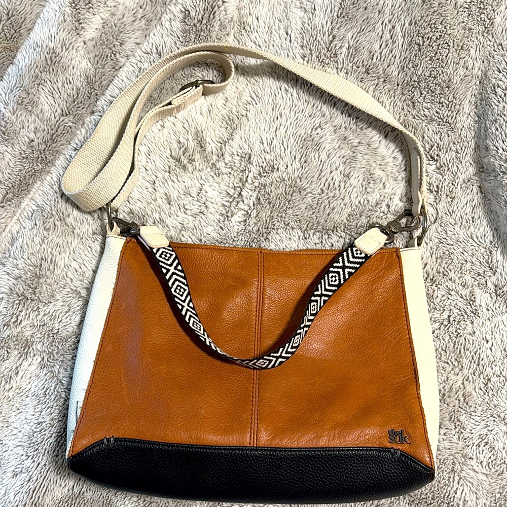 the sak , tri color purse.